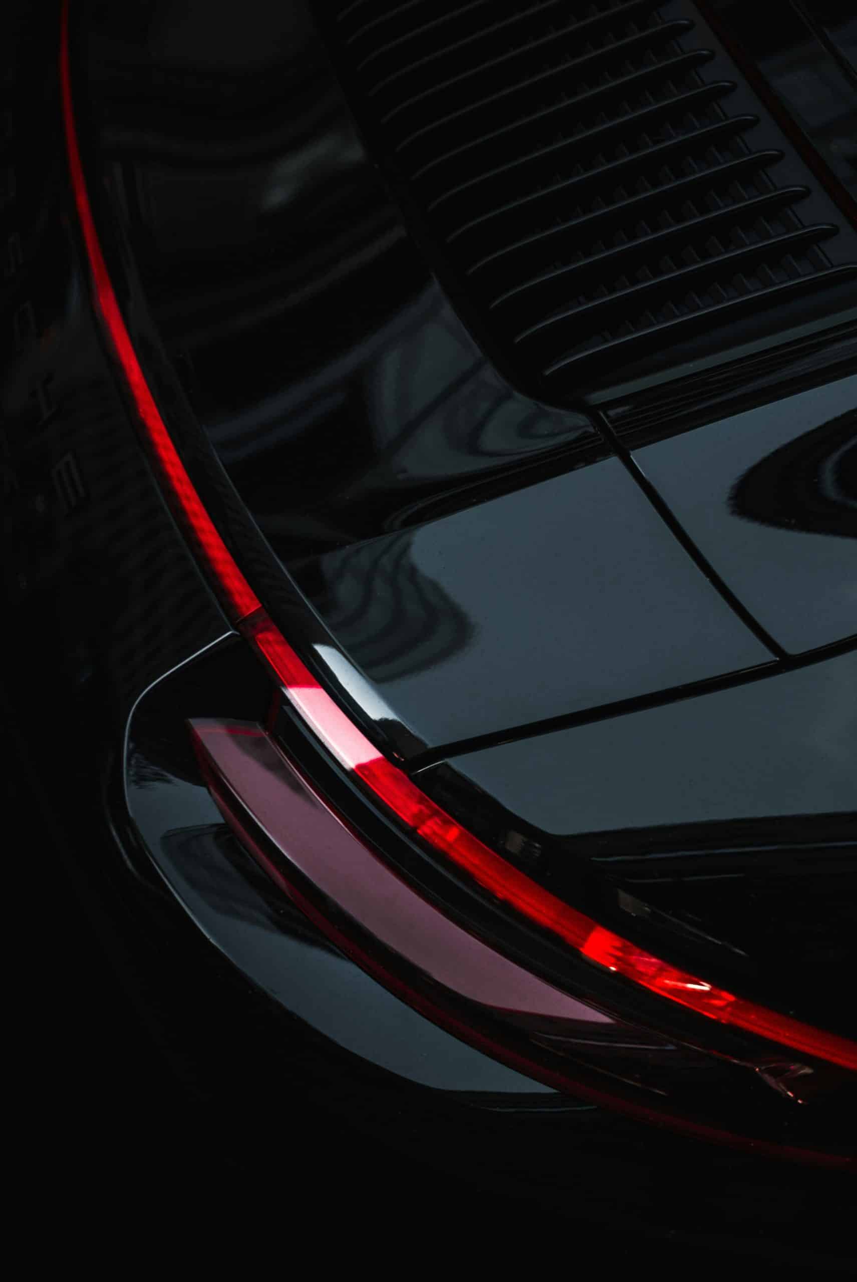 A clean car hood shot with a red back light